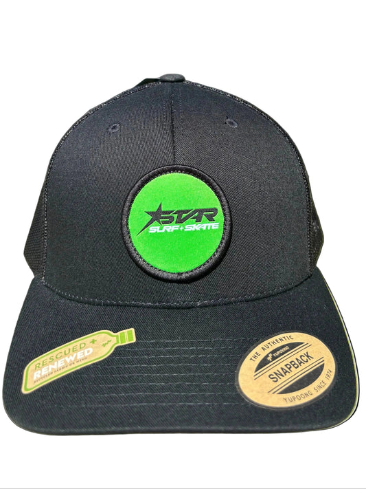 Black cap with green and yellow patches on a white background